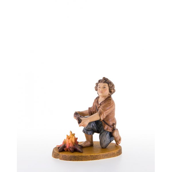 LP10600-79 - Child kneeling near the fireplace